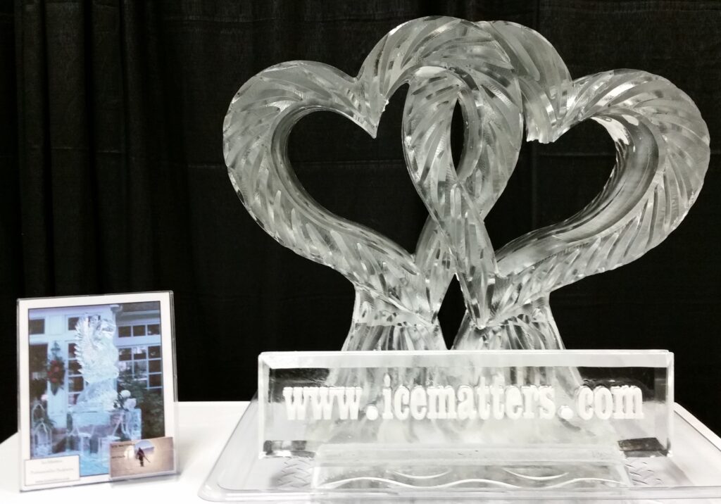 Intricate interlocking double hearts clear ice sculpture centerpiece