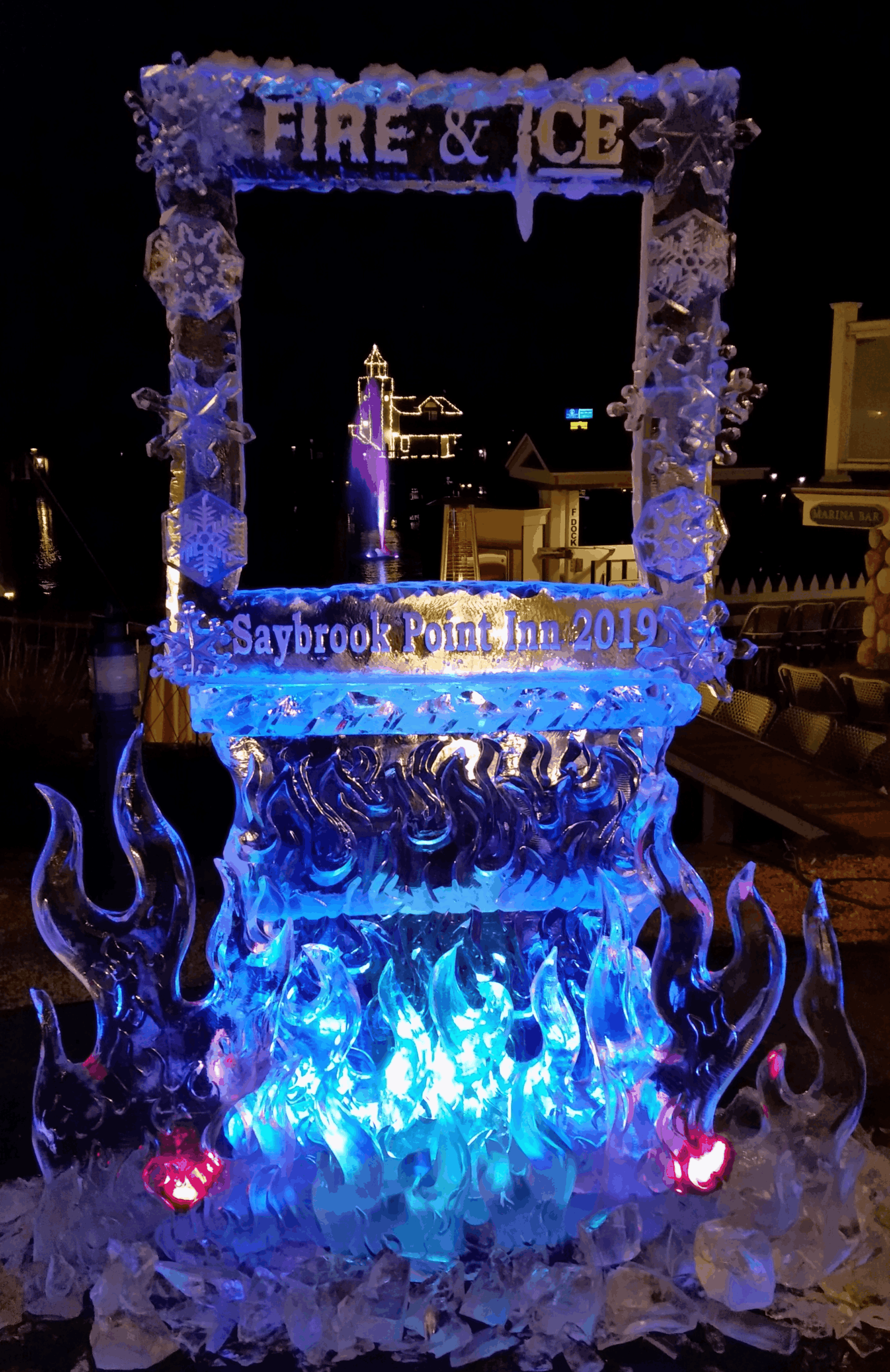 Illuminated castle ice sculpture display