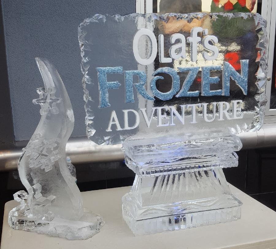 Logo with Snowfill and Blue Glitter next to Abstract Snowflake Tower