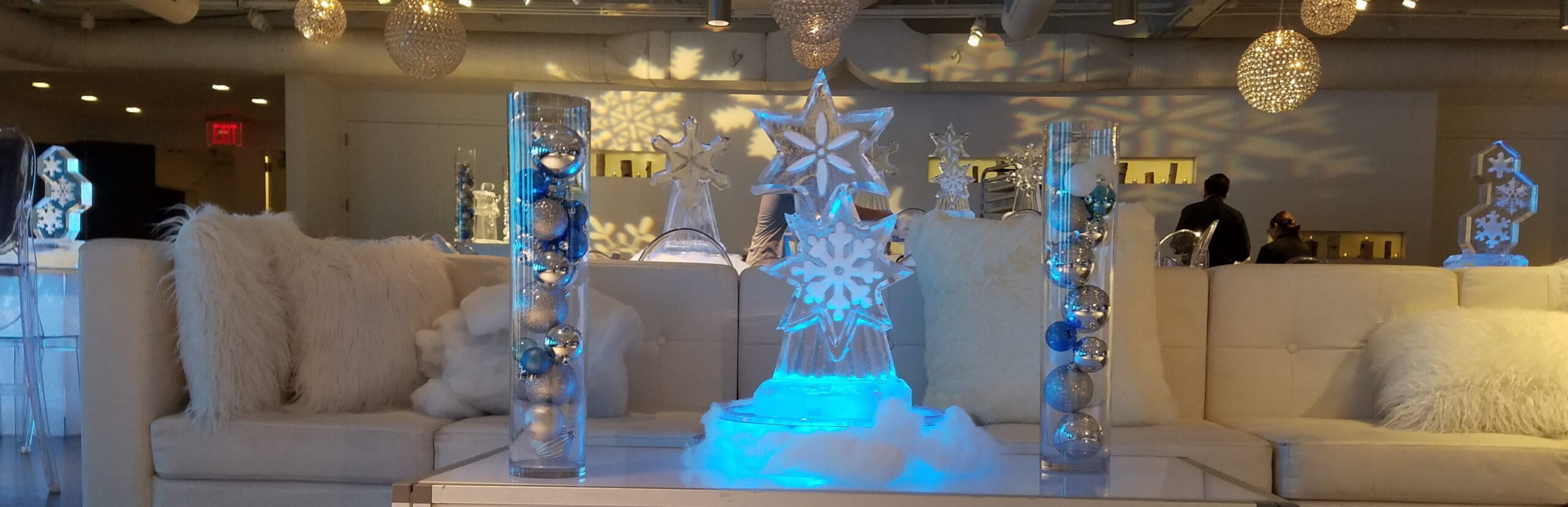 Elegant illuminated ice bar with decorative columns