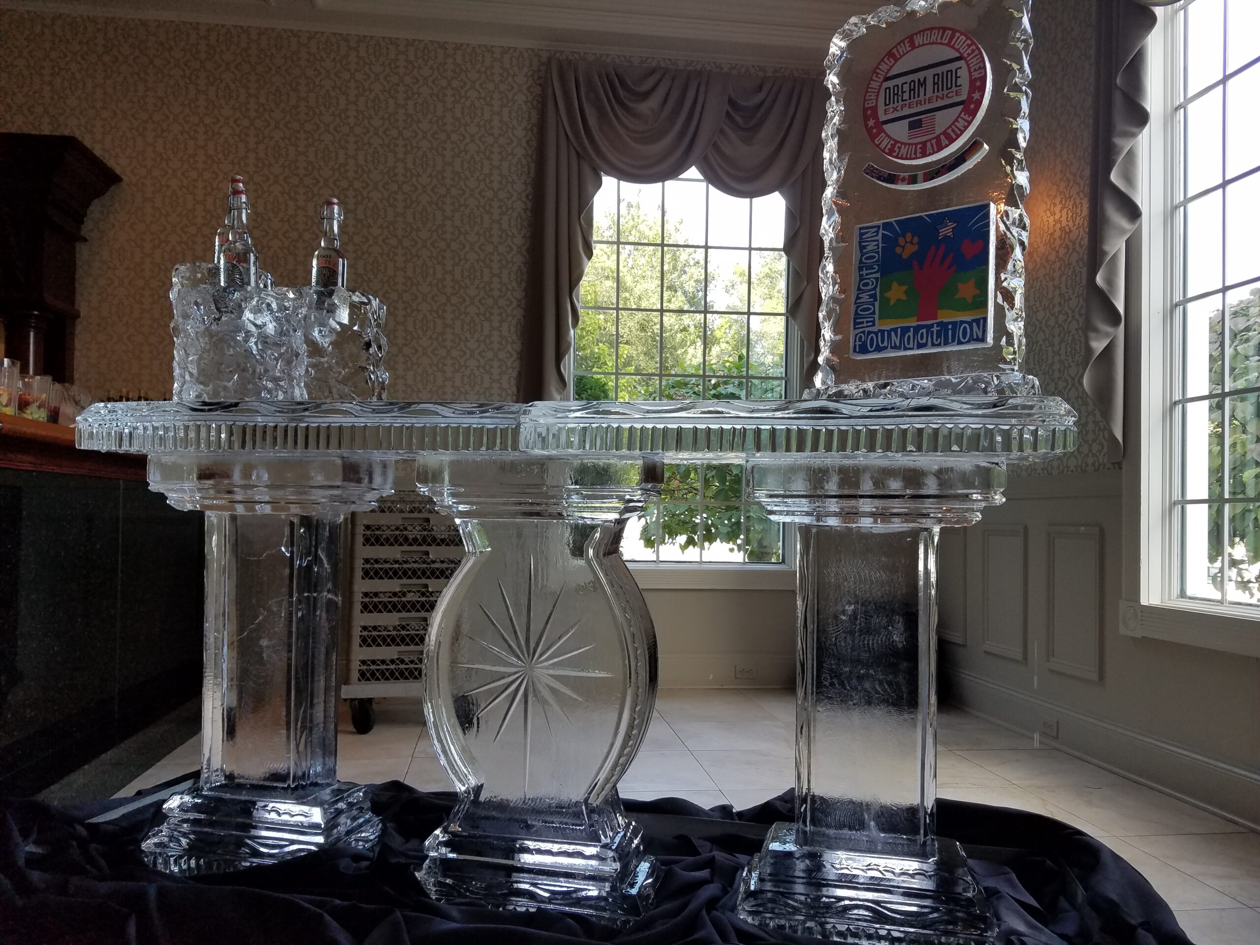 Elegant wedding ice bar with decorative ice sculptures
