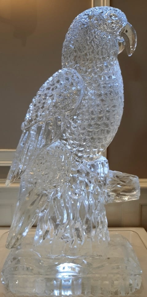 Penguin-shaped ice sculpture with textured carving