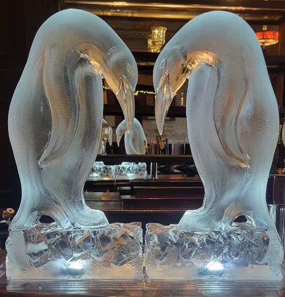 Swan ice sculpture with mirrored heart design
