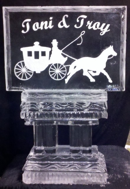 Cinderella carriage ice sculpture with horse silhouette