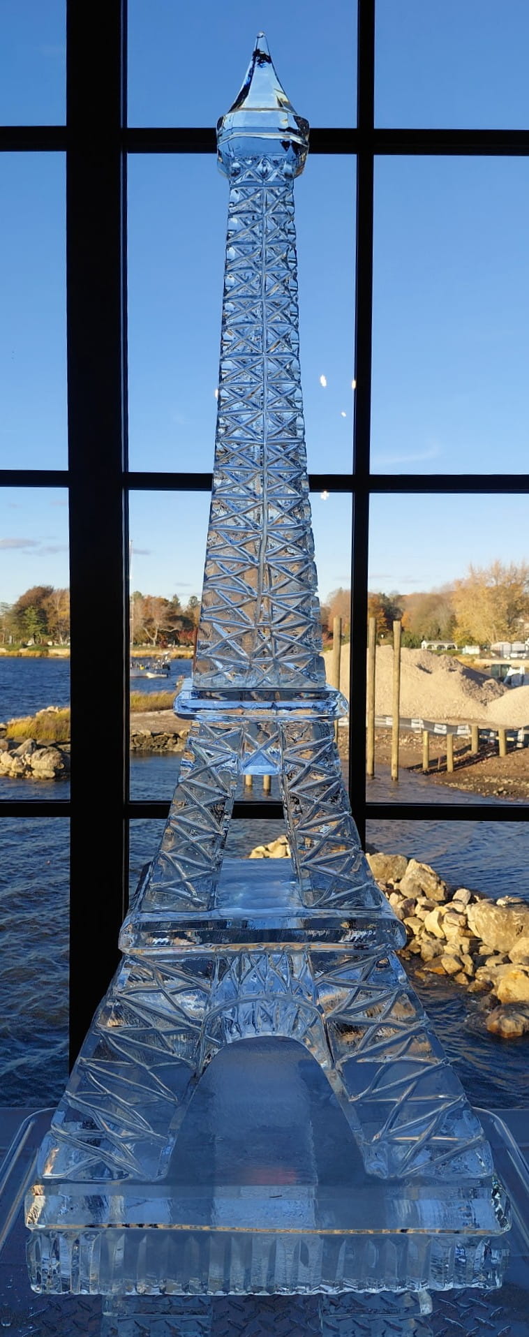 Tall stacked ice tower sculpture for event centerpiece