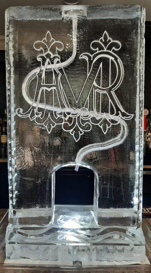 Monogram ice sculpture featuring decorative M and R initials
