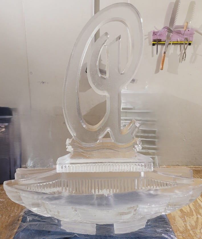 Elegant script letter G ice sculpture