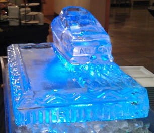 Blue illuminated fish ice sculpture