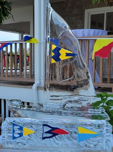Sailboat ice sculpture with nautical flags