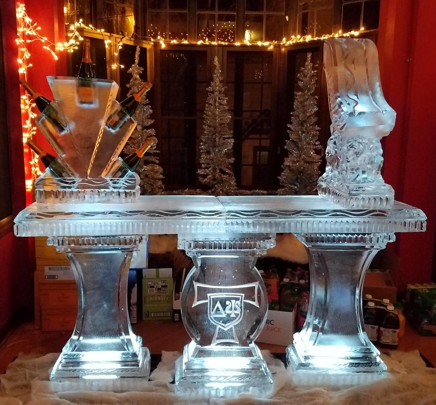 Illuminated cocktail ice bar with decorative carvings