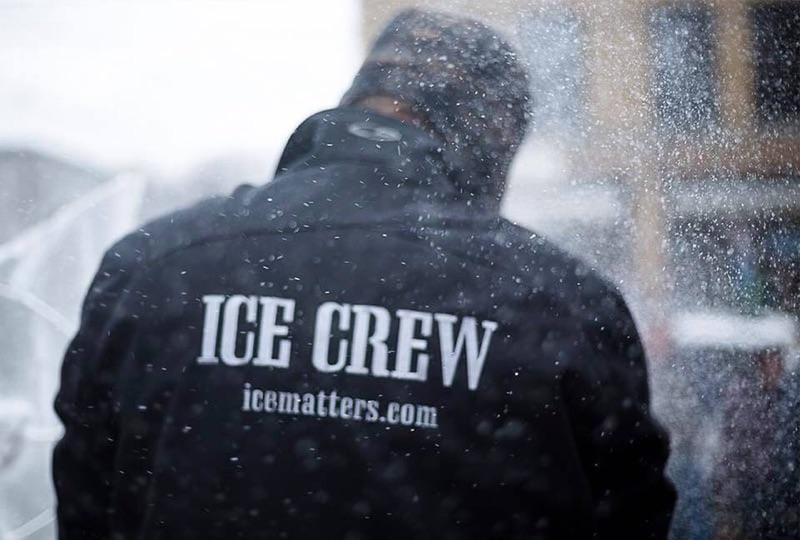 Behind the scenes view of an event worker wearing an Ice Crew jacket