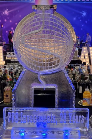 Large illuminated globe ice sculpture