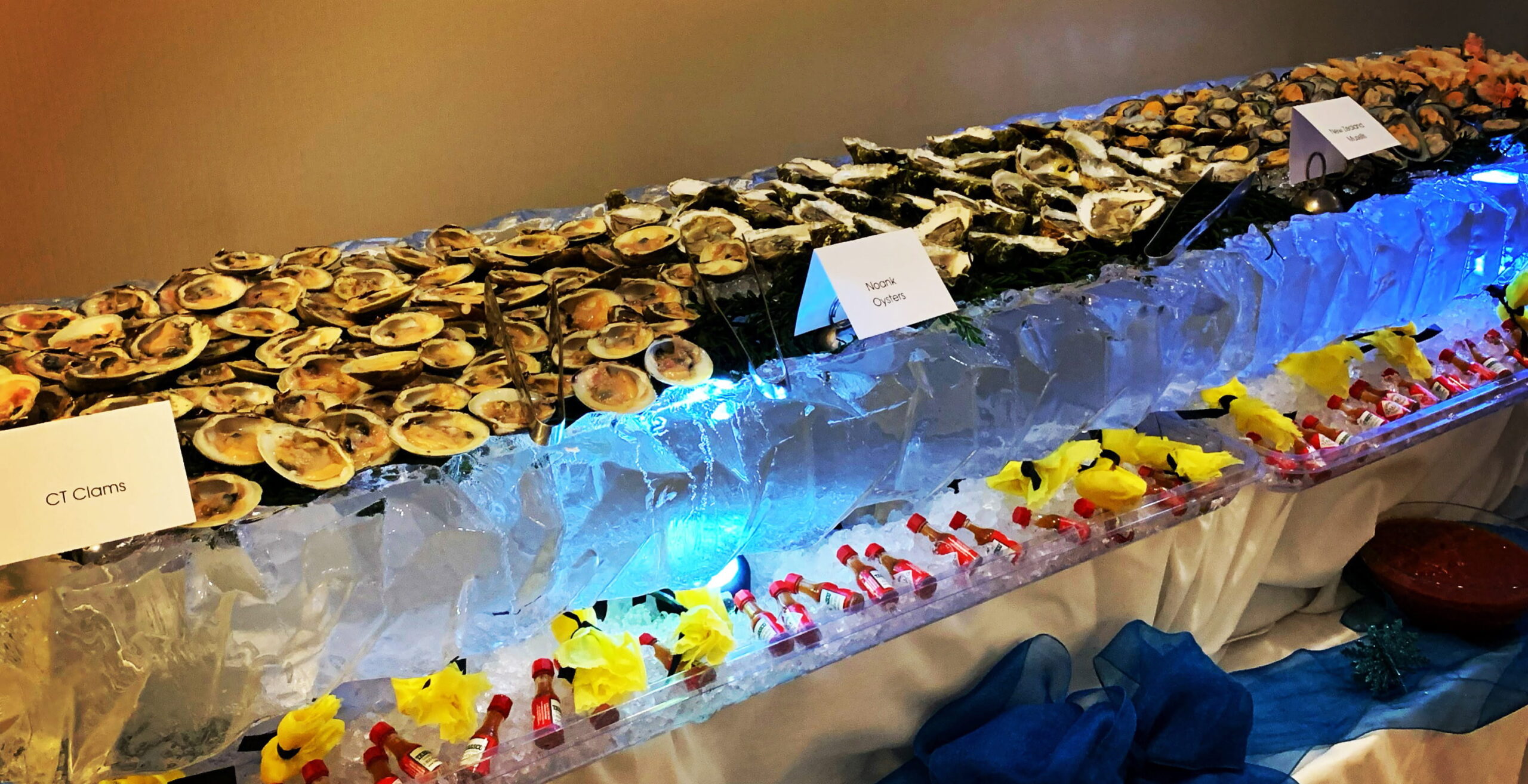 Chilled seafood buffet on illuminated ice display