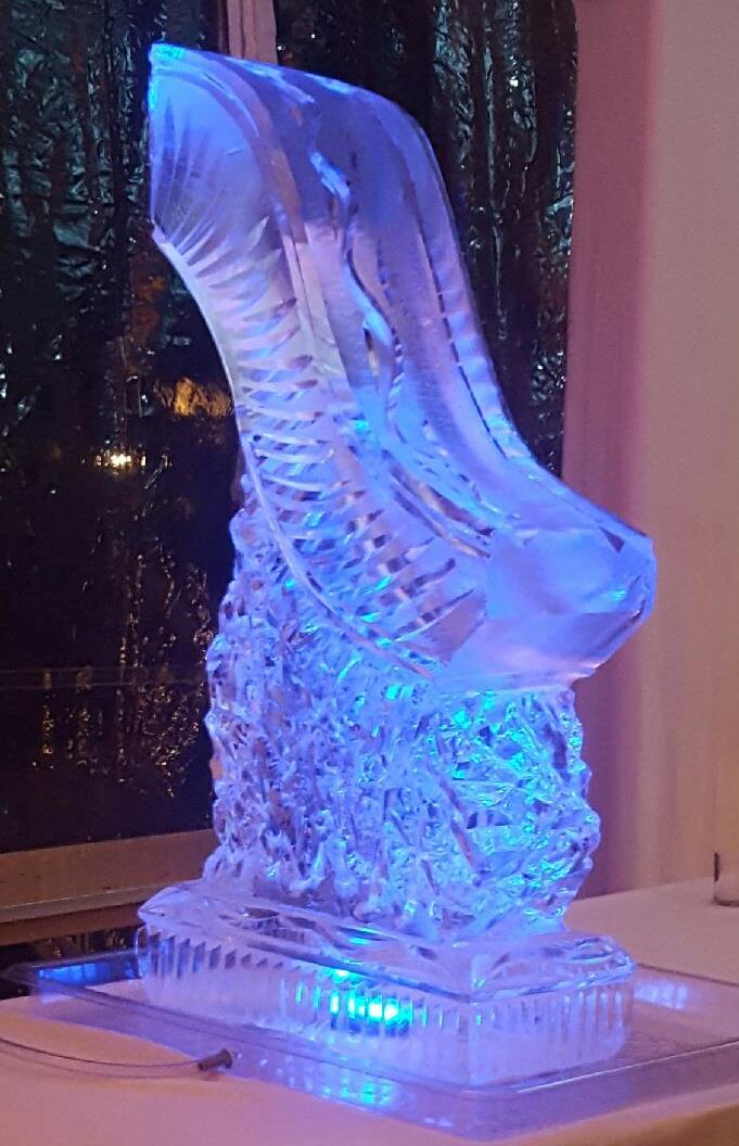 Illuminated abstract wave ice sculpture