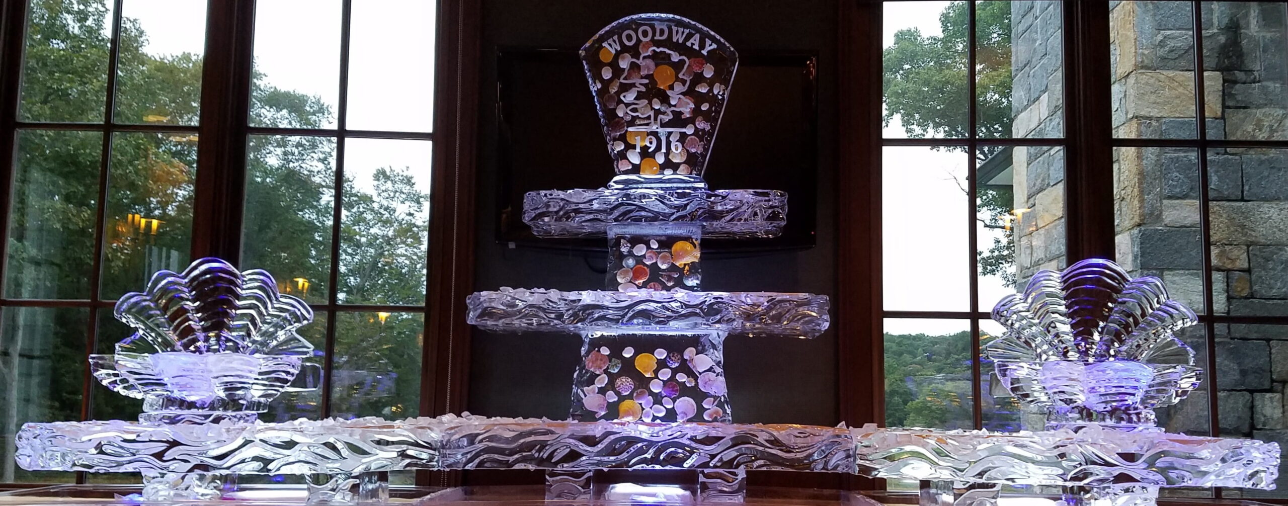 Decorative illuminated tiered ice sculpture