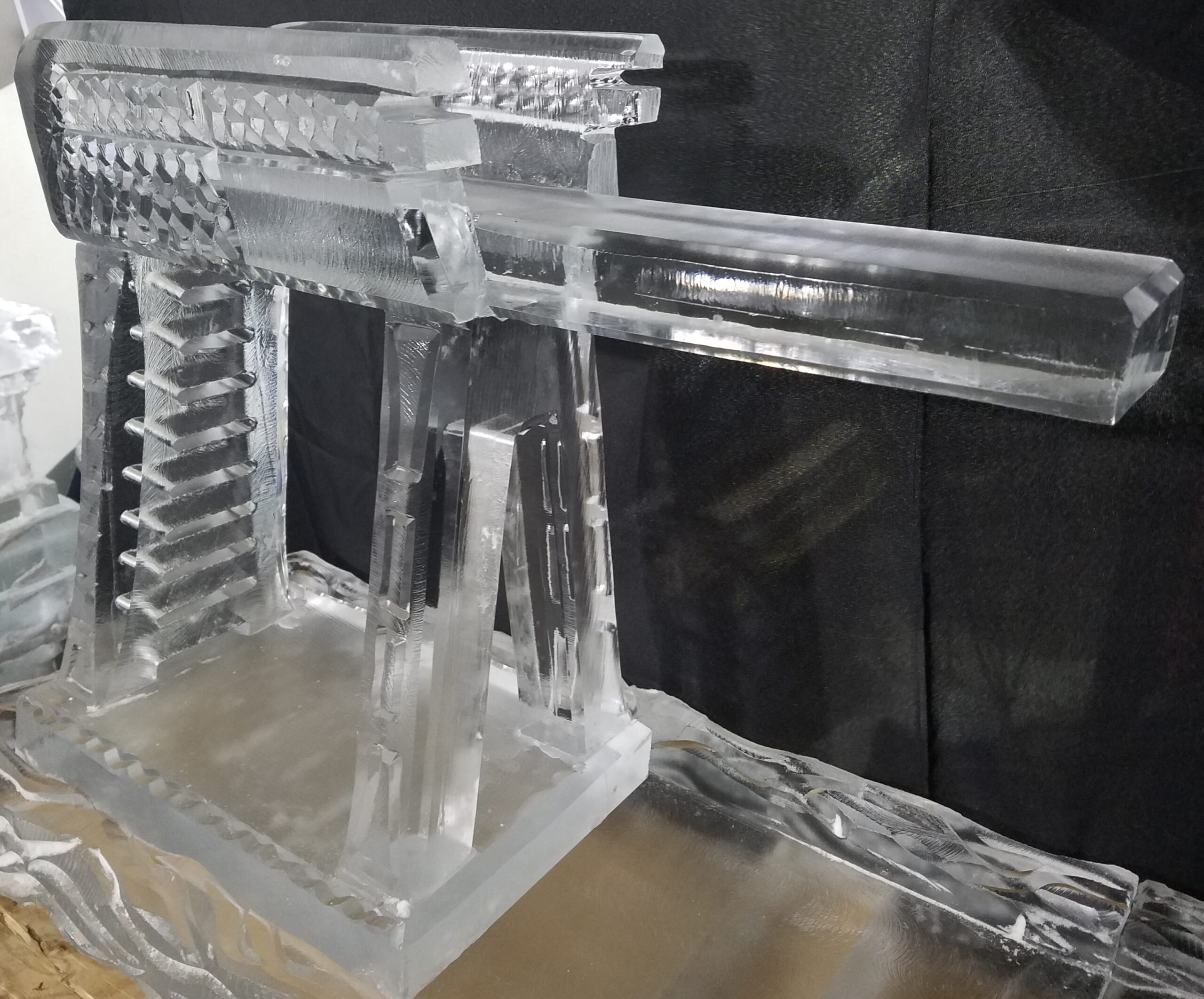 Ice bar with drink luge and serving station
