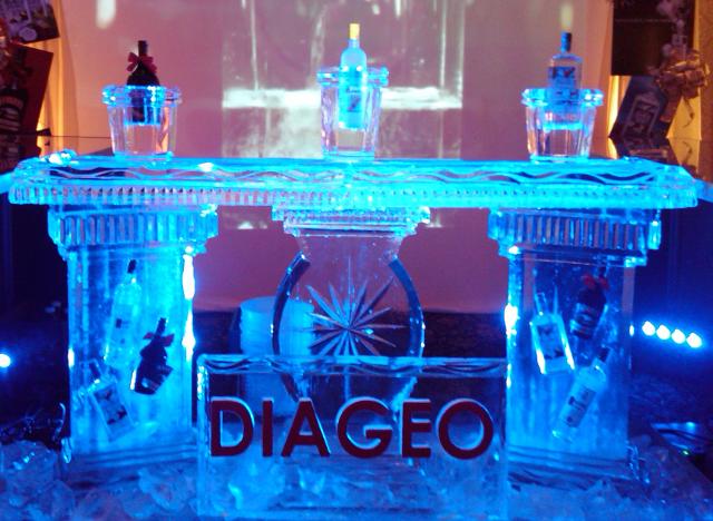 Blue illuminated custom ice bar with cocktail station