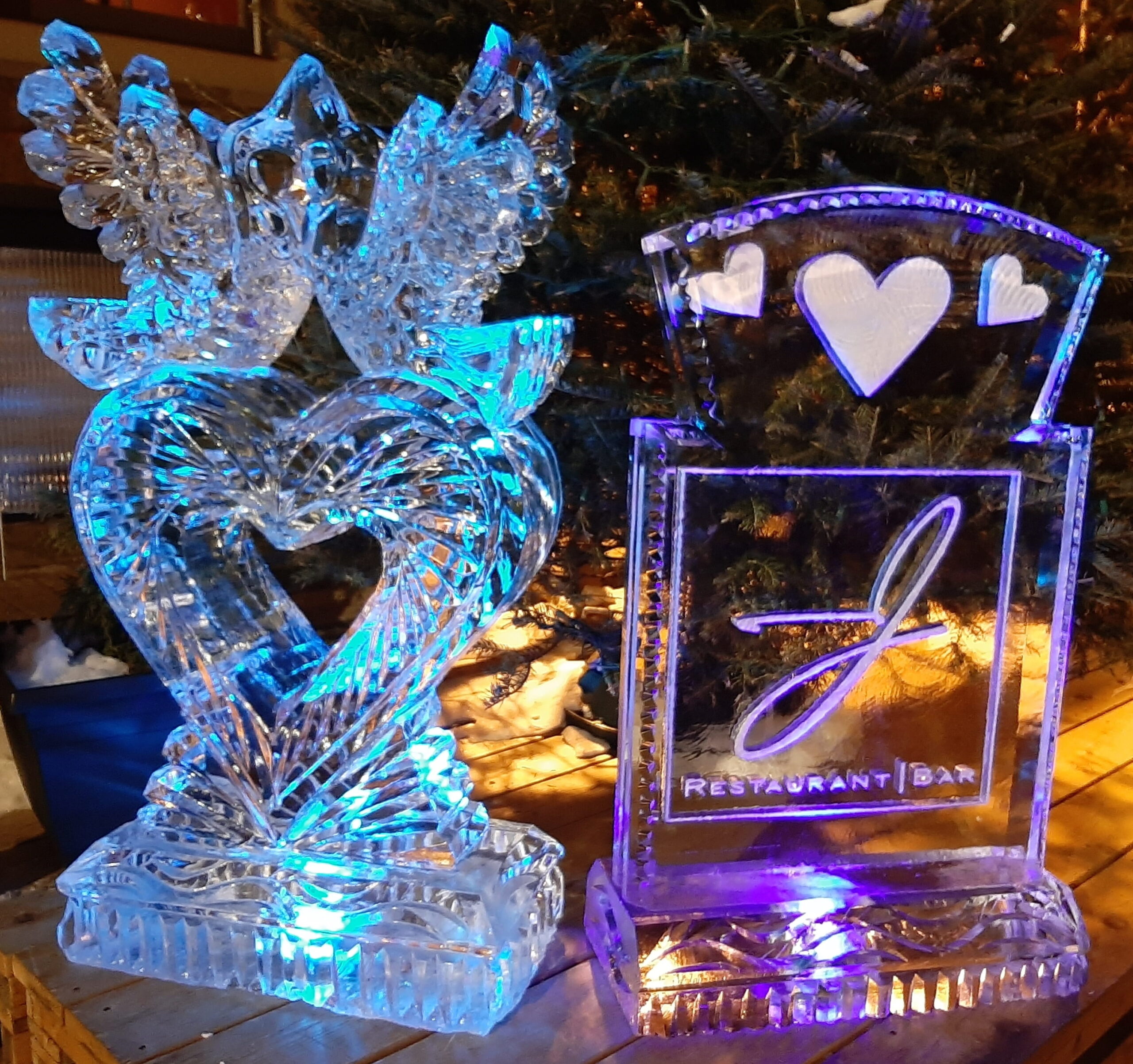 Custom interlocking guitar and heart ice sculpture with colorful LED lights