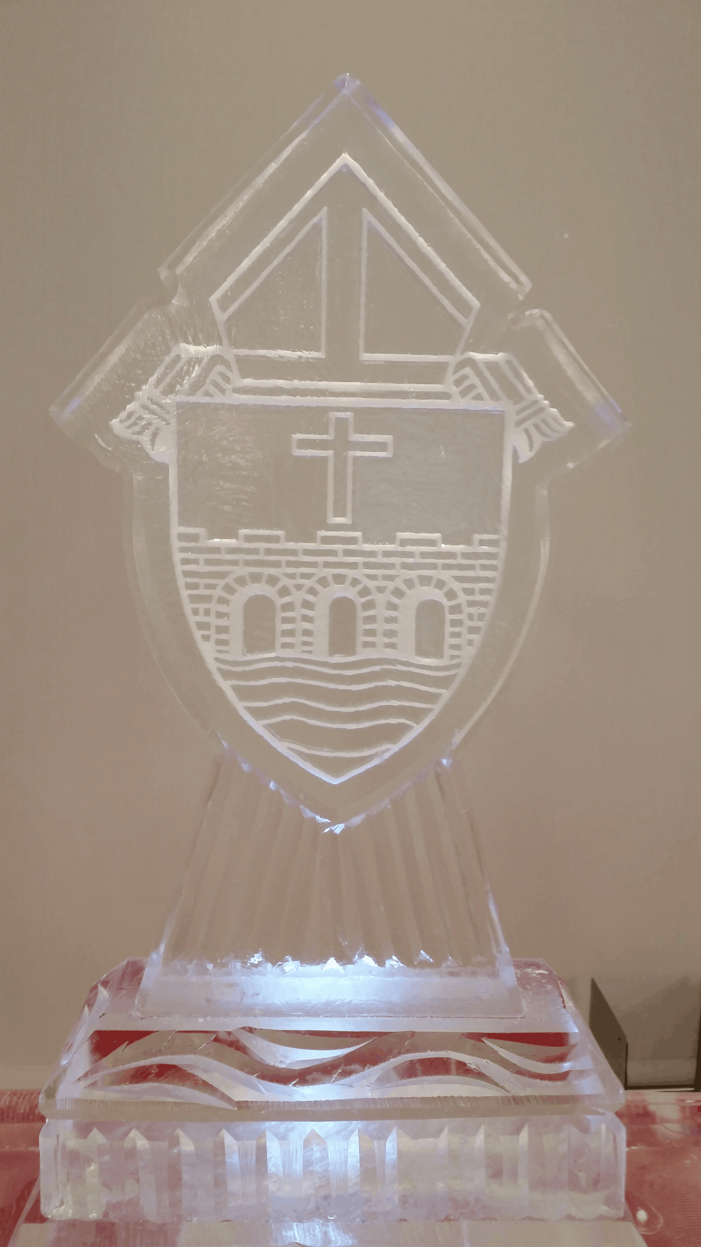 Custom shield emblem ice sculpture with fine internal architectural lines