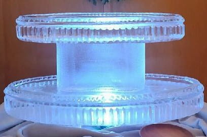 Illuminated cylindrical ice pedestal display