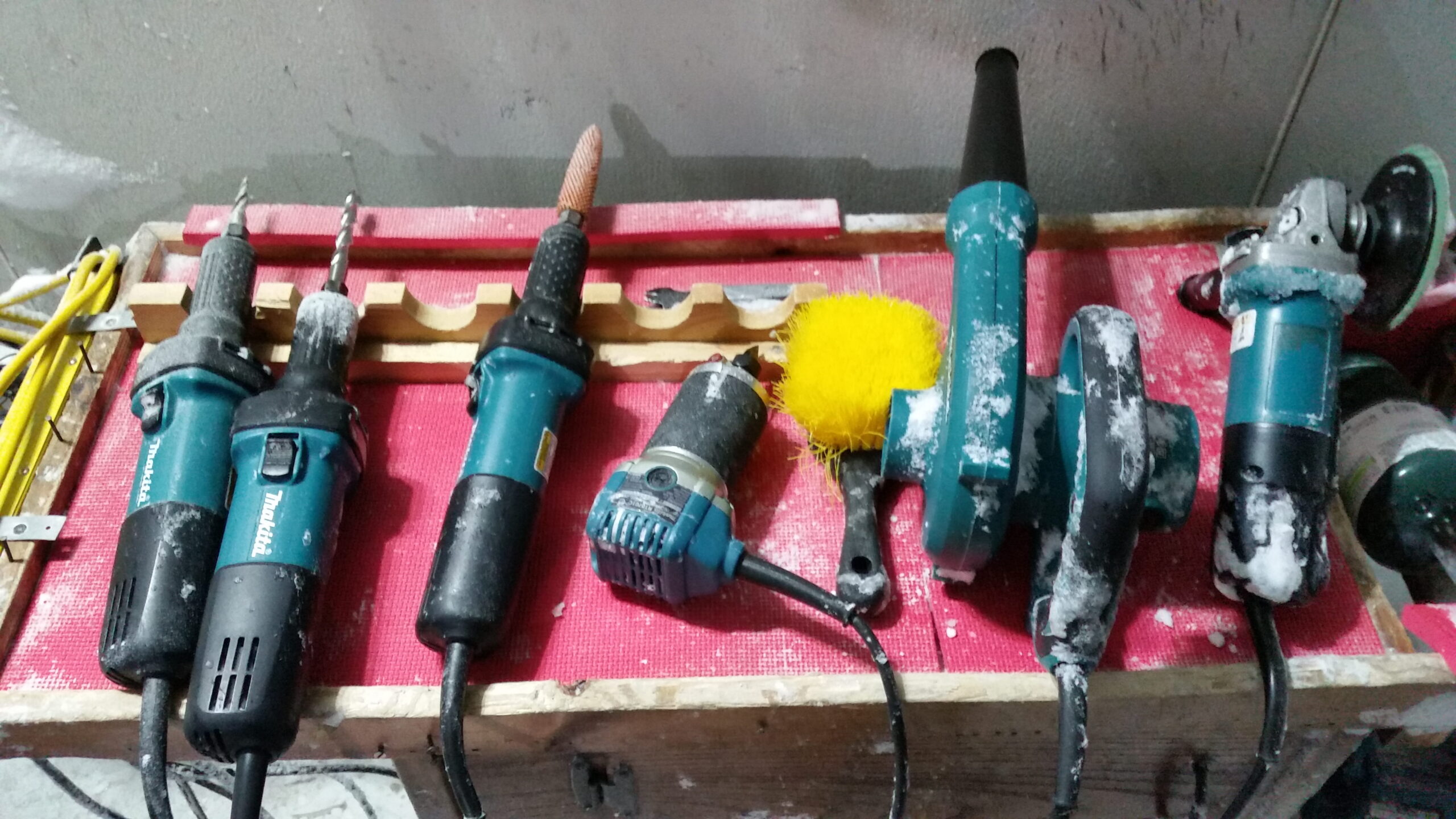 Professional power drills and chisels in a tray ready for ice carving
