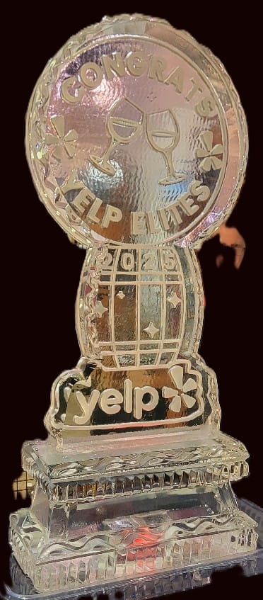Help Elves themed clear ice sculpture with stylized festive details