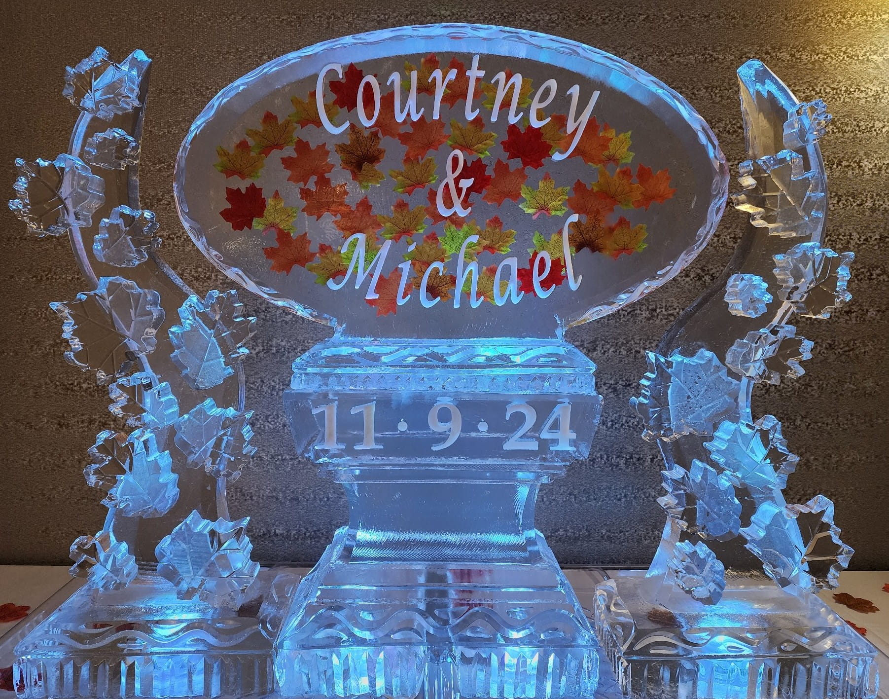 Blue lit Courtney and Michael wedding ice sculpture with date