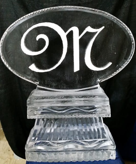 Elegant script monogram M engraved ice sculpture