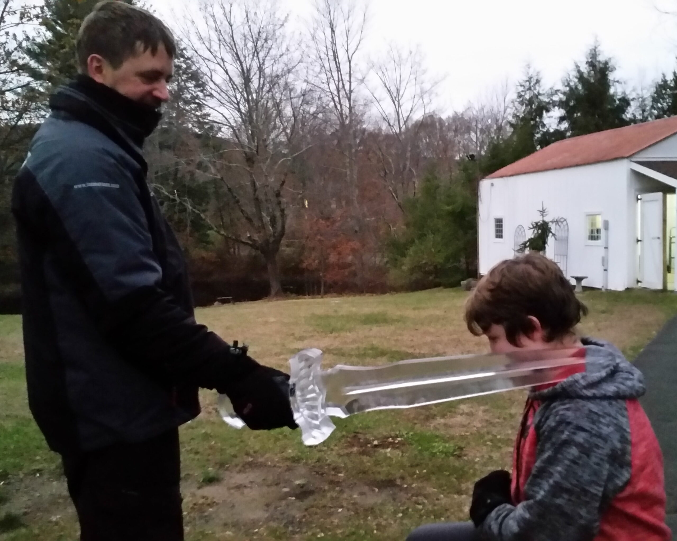 Live ice carving demonstration with child