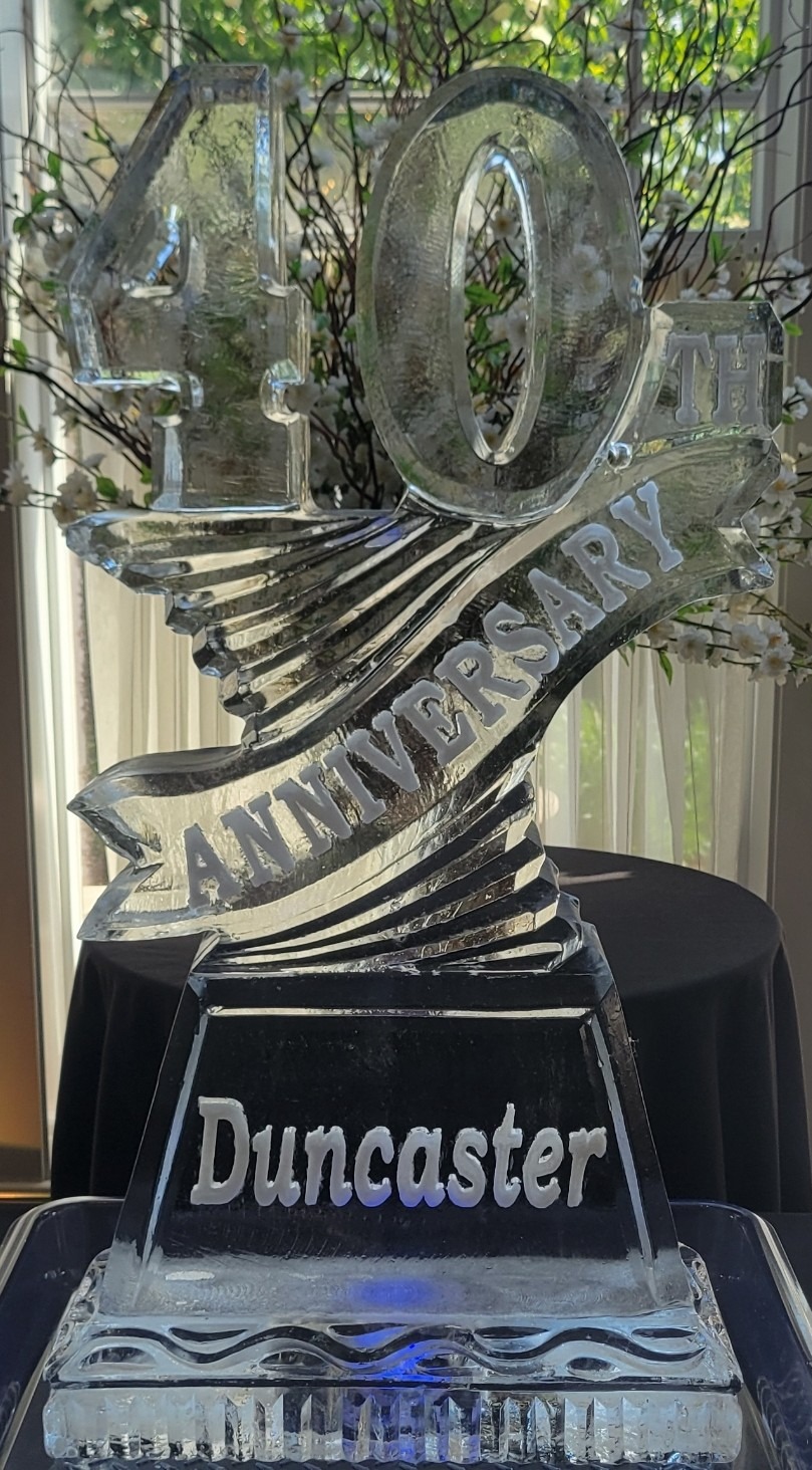 Twisting anniversary ribbon ice sculpture