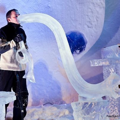 Unique curved architectural ice pipe structure winding across a snowy display