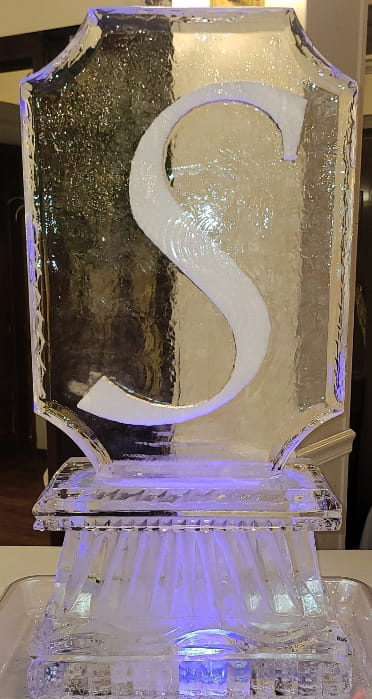 Decorative letter S ice sculpture with flowing design