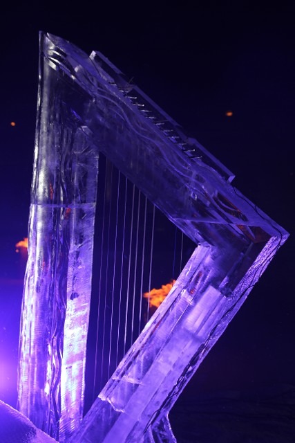 Ornate ice sculpture carved to resemble the delicate strings of a musical harp