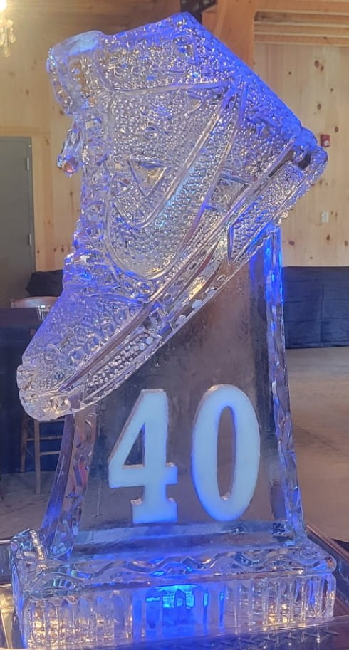 High-heel shoe ice sculpture with blue lighting
