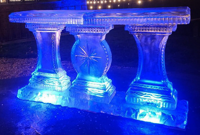 Blue illuminated ice arch centerpiece
