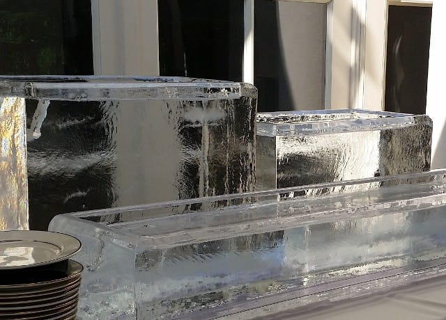 Clear ice buffet display with carved ice blocks