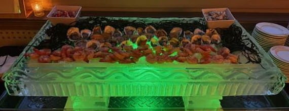 Green illuminated ice buffet display